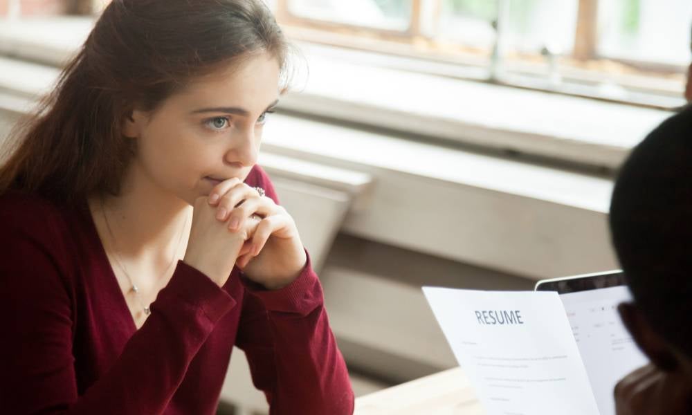 Nervous job seeker shows resume to recruiter .jpeg