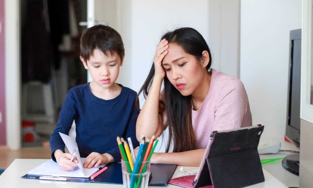 Woman is homeschooling her child instead of work gender inequality in the labour force leads to underemployment .jpeg