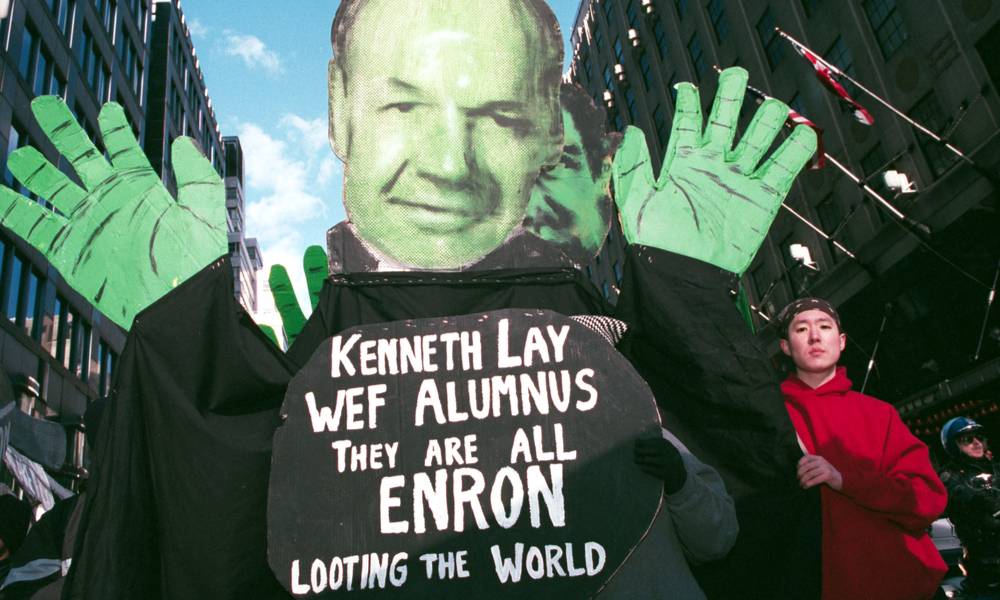 Protesters hold up an effigy of Enron's Kenneth Lay during a march against the World Economic Forum on February 2, 2002 in New York City.jpg