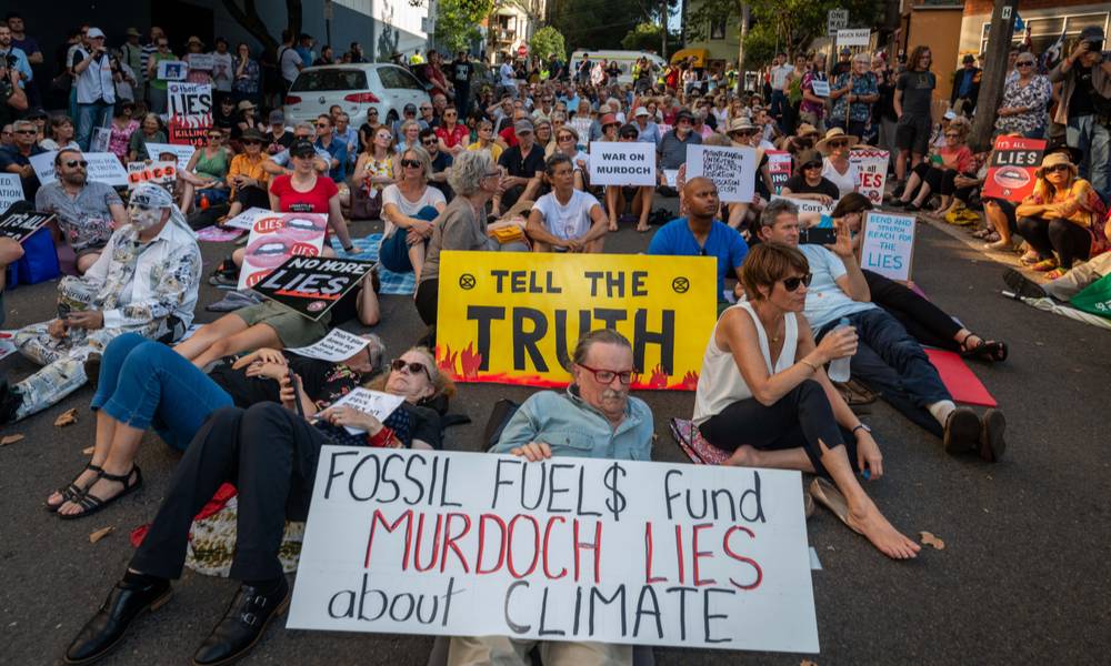 Hundreds of climate activists lie down in front of News Corp Australia headquarters calling the Murdoch press liers.jpg