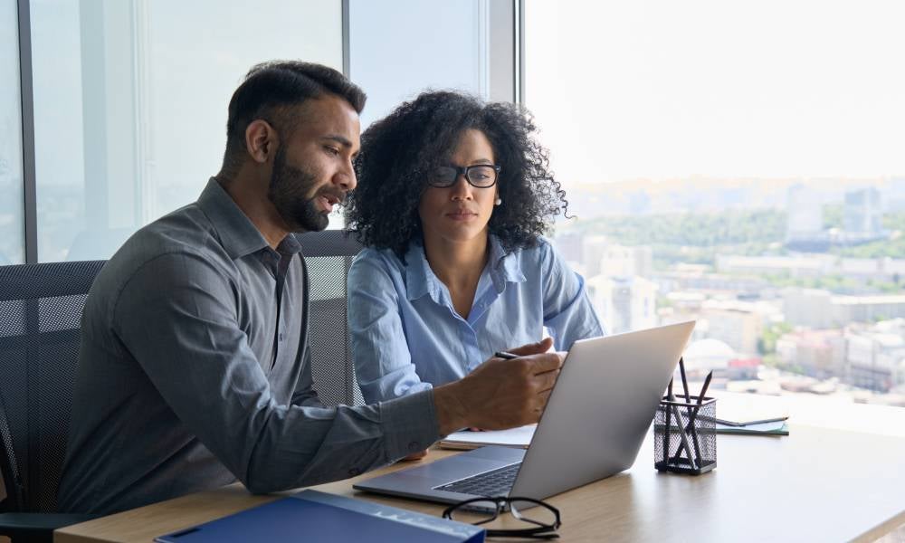 Two agents talking provide free tax advice for financial wellbeing.jpeg