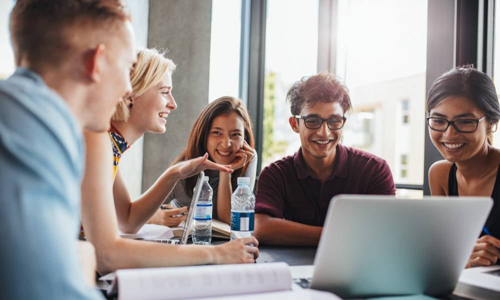 Young students studying together talking about superannuation.jpeg