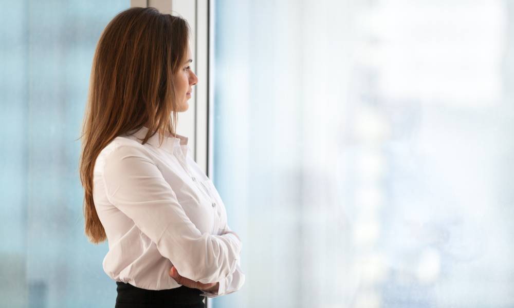 Successful thoughtful businesswoman and transformational leader looking out of window.jpg