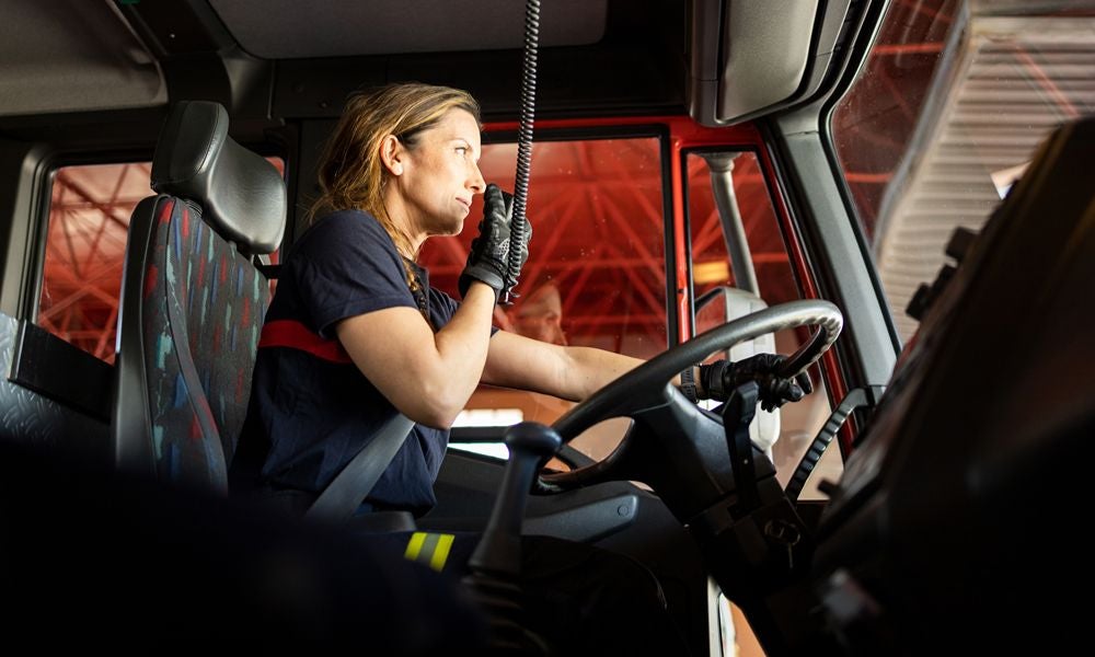 Women truck drivers help maintain vehicles.jpeg
