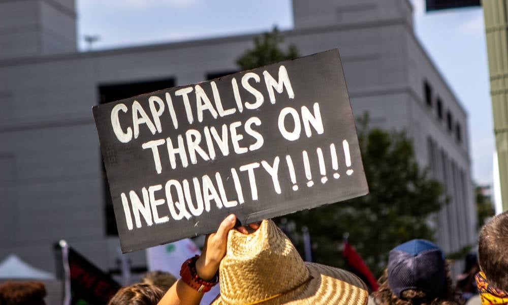 Sign reads cpitalism thrives on inequality.jpeg