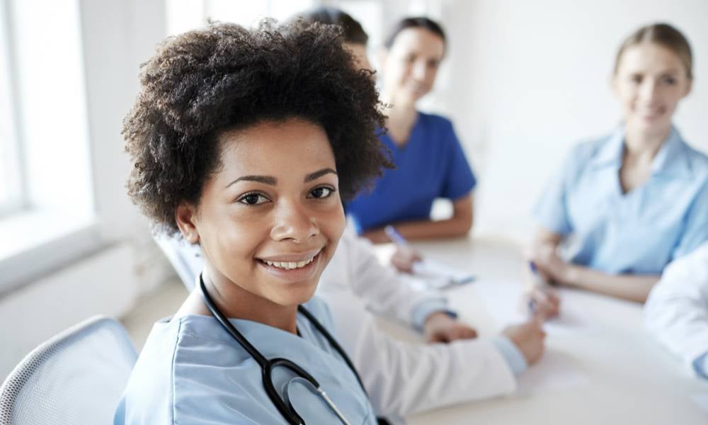 Women health workers together happy.jpeg