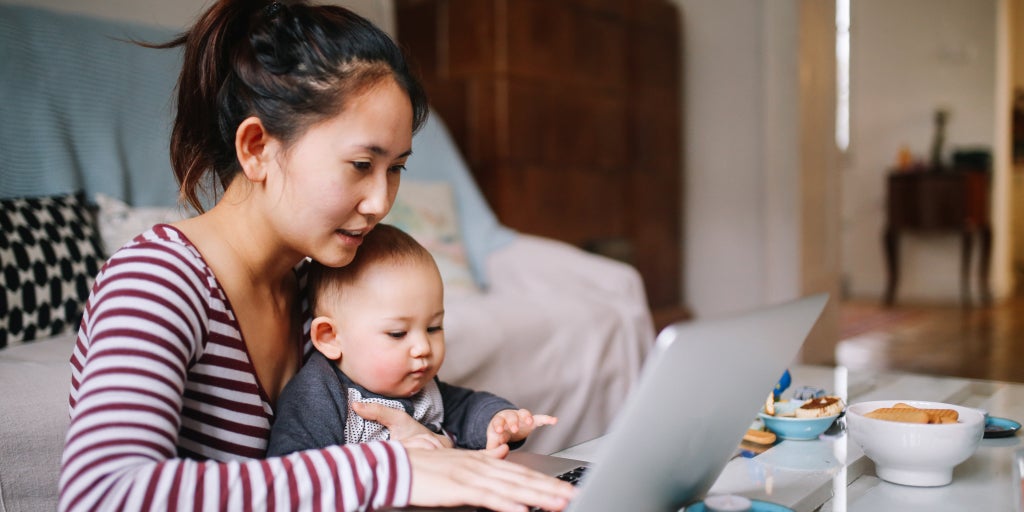 Mother and baby looking a laptop