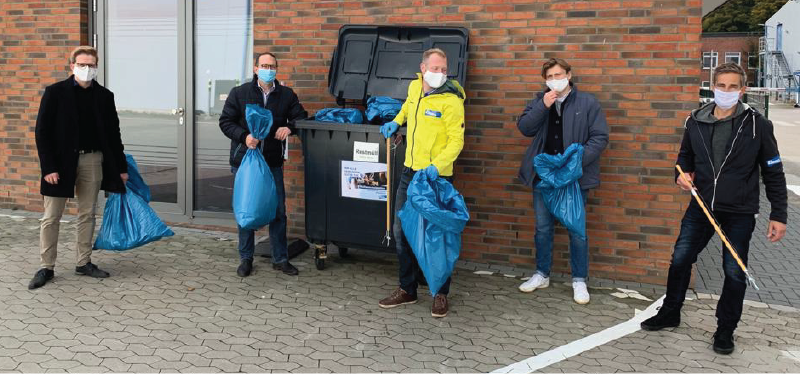 Elanco employees picking up garbage