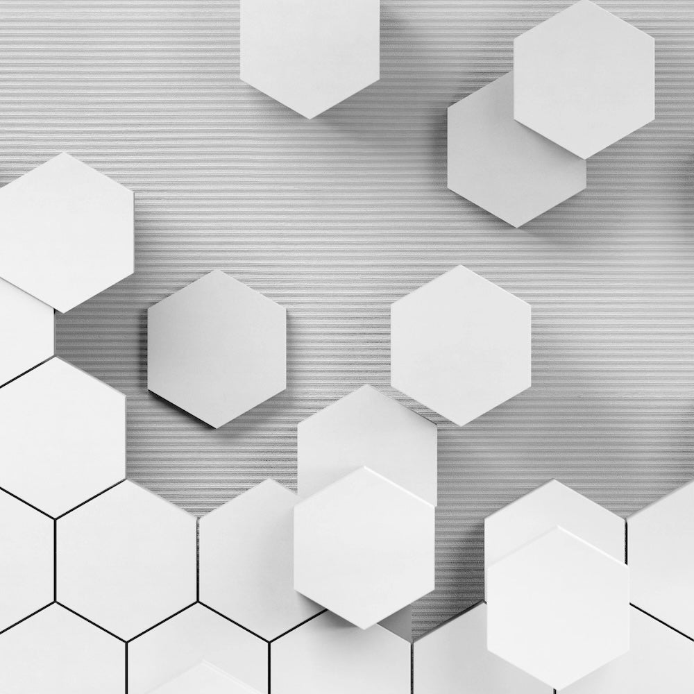 Light gray hexagons on a darker gray, textured background