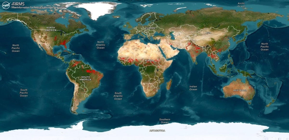 A map of Earth with wildfires highlighted in red