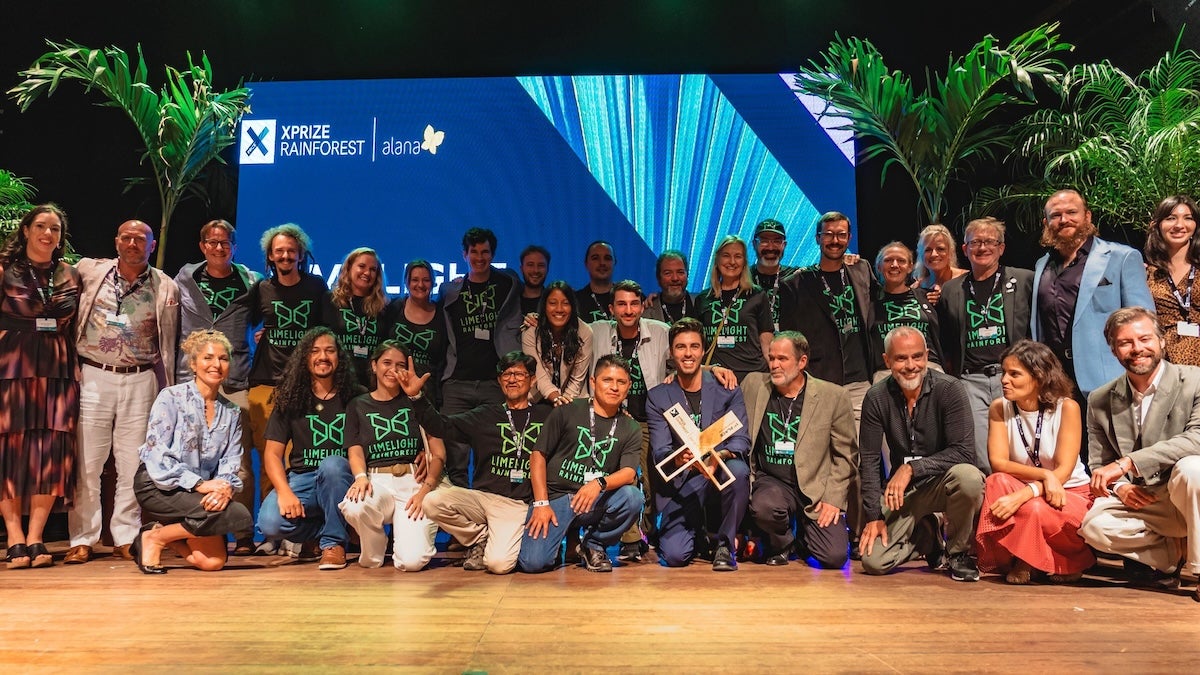 XPRIZE Rainforest winners Limelight Rainforest (formerly Team Waponi) pose on stage with team members from XPRIZE and sponsor Alana Foundation during G20 in Rio di Janeiro, Brazil.