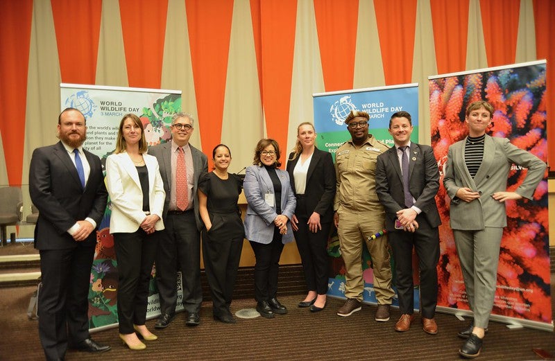 XPRIZE's Peter Houlihan stands at the United Nations with a group of speakers, including Ivonne Higuero, Secretary-General of the United Nations' Convention on International Trade in Endangered Species of Wild Fauna and Flora (CITES)
