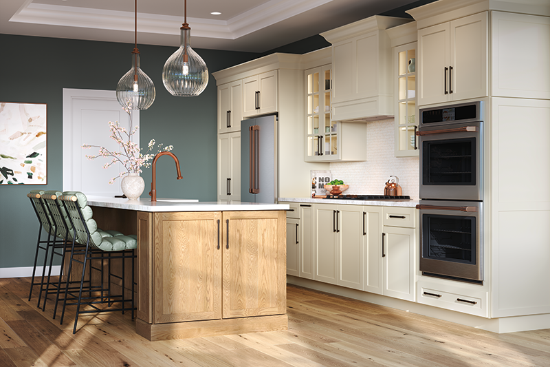 Kitchen with wood floors, white cabinetry, and green walls.