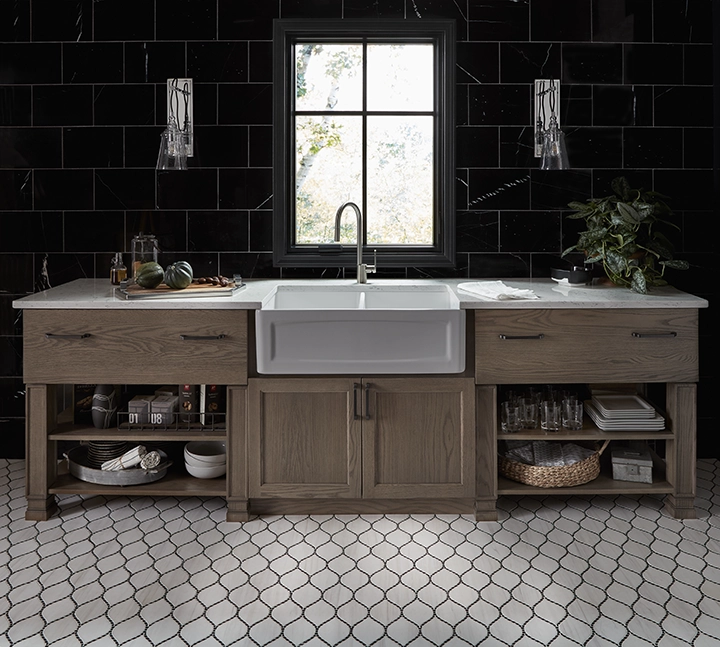 A New England style kitchen with farmhouse sink.