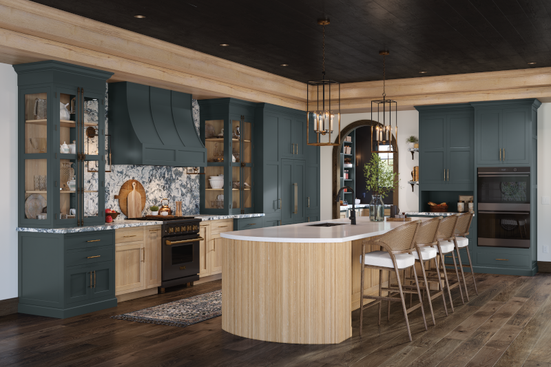 A kitchen with contrasting green and wood-tone cabinets, a wood-island, and island seating.
