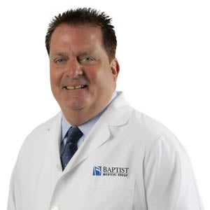 Dr. Vincent Barker in white coat
