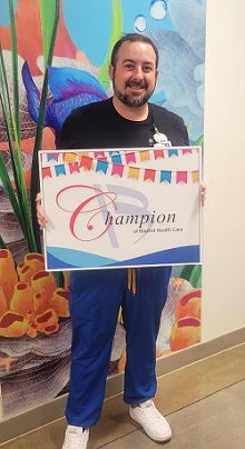 Andy poses with Champion recognition