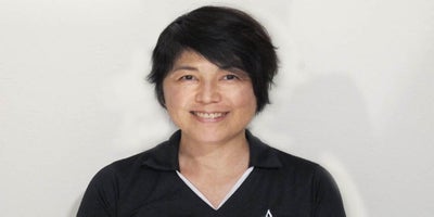 Smiling face of Akiko Hashido, a team member at Andrews Institute