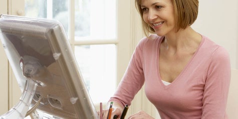 Woman working on a computer from home in a personal space