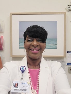 patient representative Veronica, black female with badge wearing suit