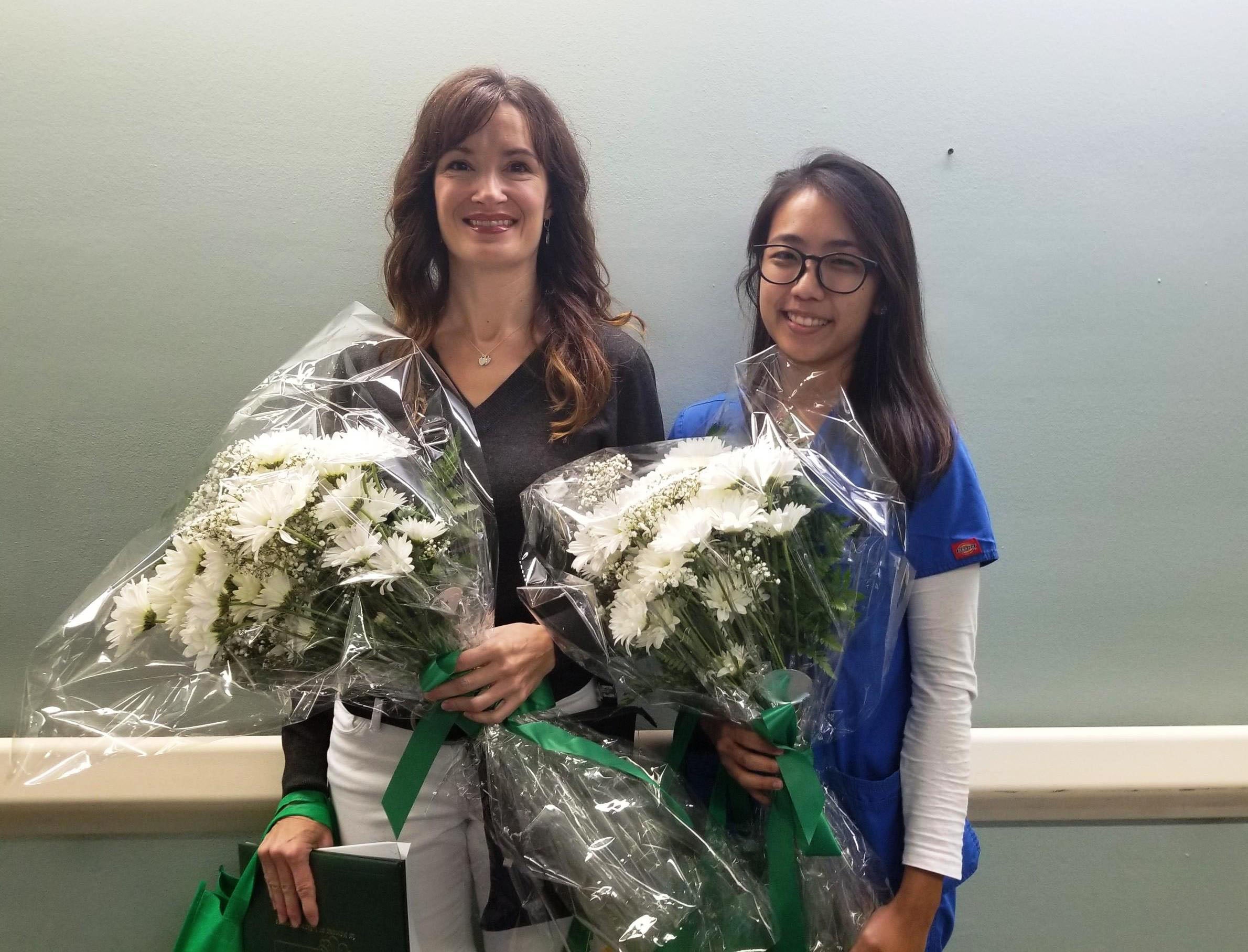 Photos of Nicole Davis and Mutia Scull standing next to one another holding flowers and certificate. 