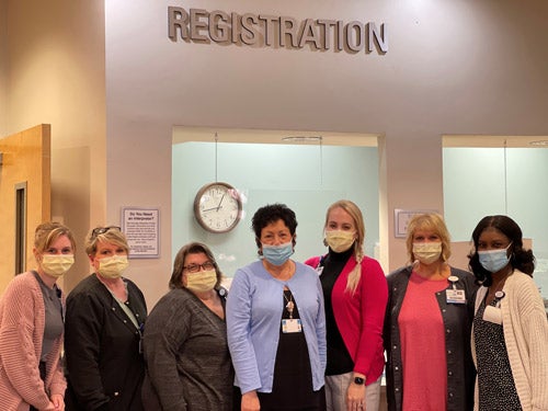 Baptist Medical Park - Nine Mile registration team members pose for camera.