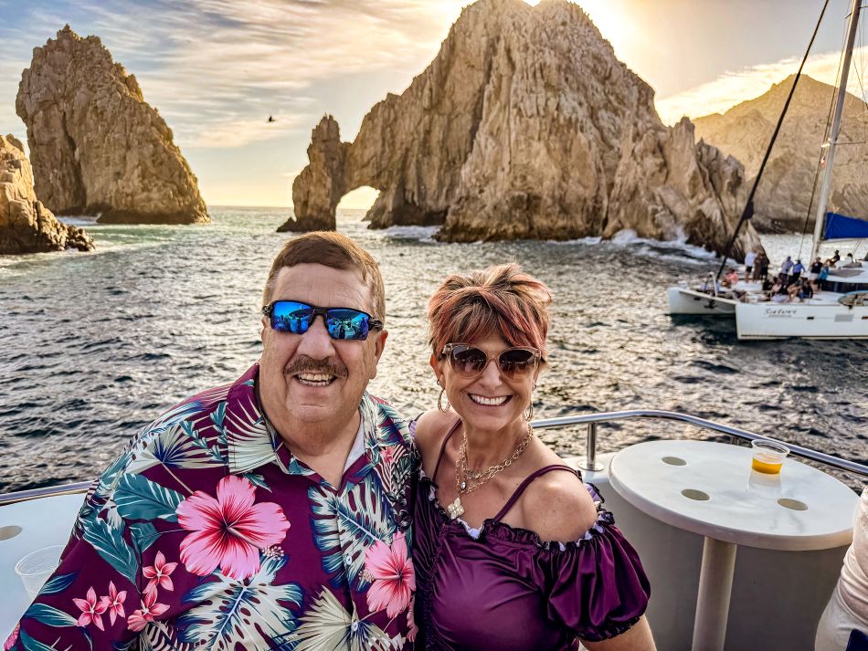 Amy and husband Gary on a boat while on vacation.