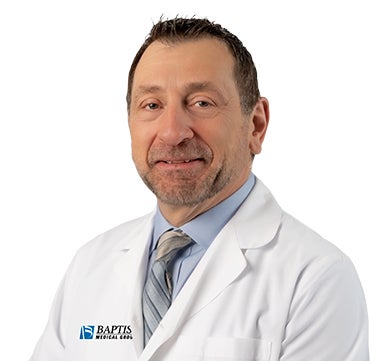 Headshot of Dr. Frank Francone in a white jacket
