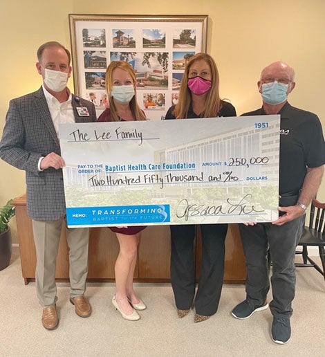 Mark Faulkner, KC Gartman, Jessica Lee and Monroe Lee holding $250,000 check.