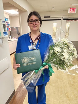 JoAnn Wentland holding flowers