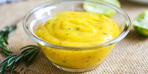 Mango salad dressing in a small bowl 