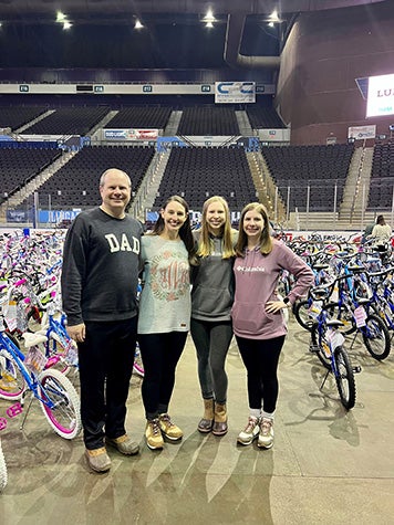 Emma Ward with her family, dad Mike, mom Brooke and sister Alexa at the Pensacola Bike Build in December, 2022.