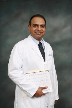 Dr. Sumit Verma in white coat