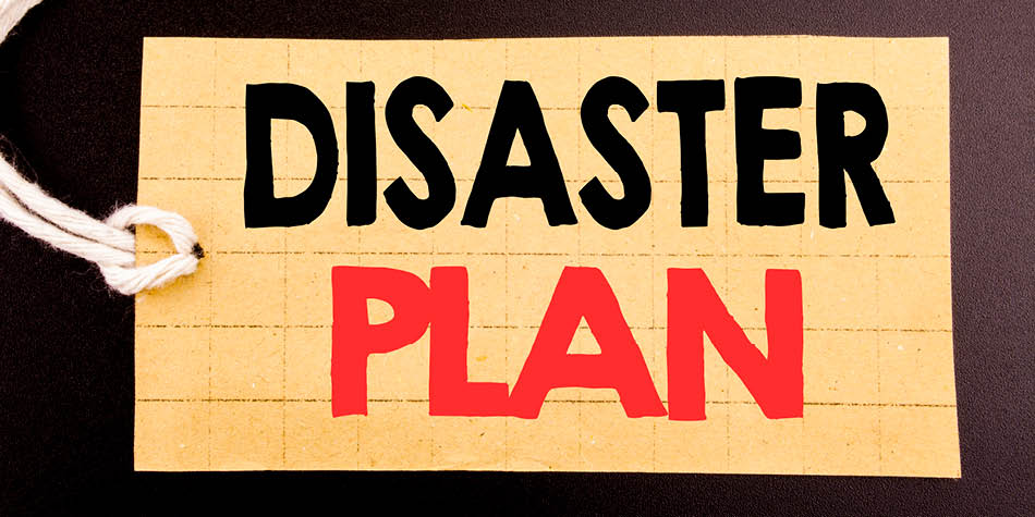 Words say disaster plan on a piece of paper