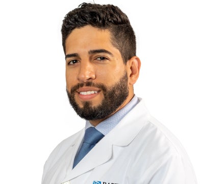 Dr. David Echeverri wearing a Baptist Medical Group white coat.