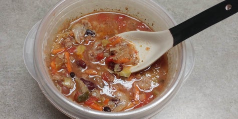 A soup filled with ground turkey, beans, cabbage, vegetables, tomatoes and broth