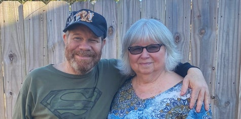 Patient Wesley puts his arm around mom, Marilyn