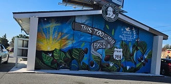 Mural on mental health and suggestion to call or text 988 for help.