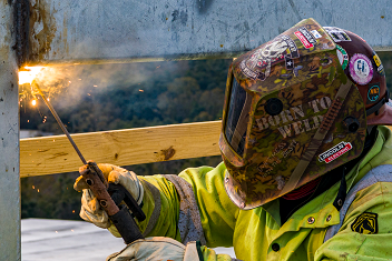 Welder in action at construction of new Baptist Hospital campus