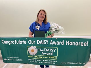 Mindy Hodges, Baptist labor and delivery nurse, was honored with a DAISY award.