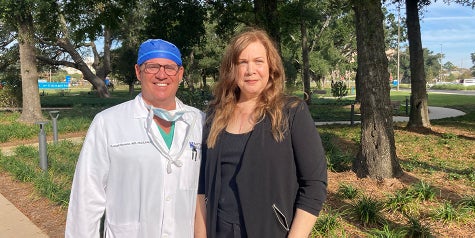 Dr. Ronson poses next to heart surgery patient Stephanie Hall