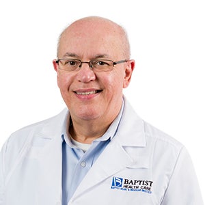 Head and shoulders shot of Dr. Jose Guitian wearing glasses and a Baptist Health Care white coat.