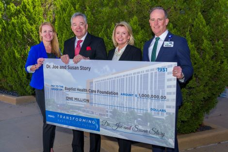 KC Gartment, Dr. Joe Story, Susan Story, Mark Faulkner holding big check