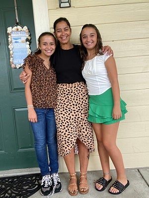 Melissa with her twin daughters, who are age 12