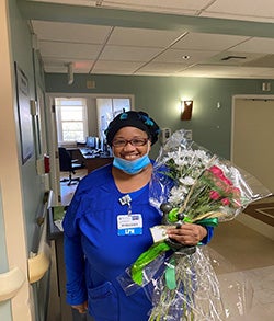 Cassandra Reuben holding flowers