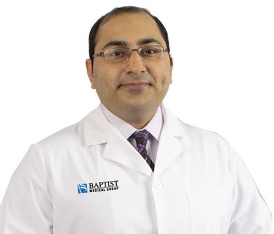 Dr. Syed in white coat.