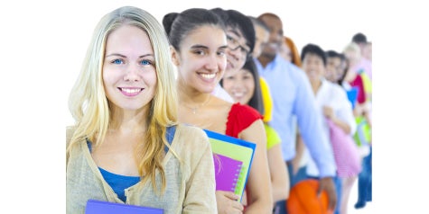 Line of people with text books smiling