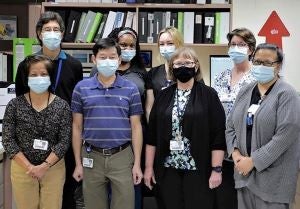 Microbiology team pictured wearing masks 