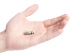 Hand holding world's smallest pacemaker