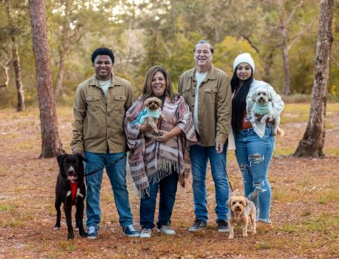 Lori Gurule-Rat, Native American, pictured with her adopted children, husband and dogs